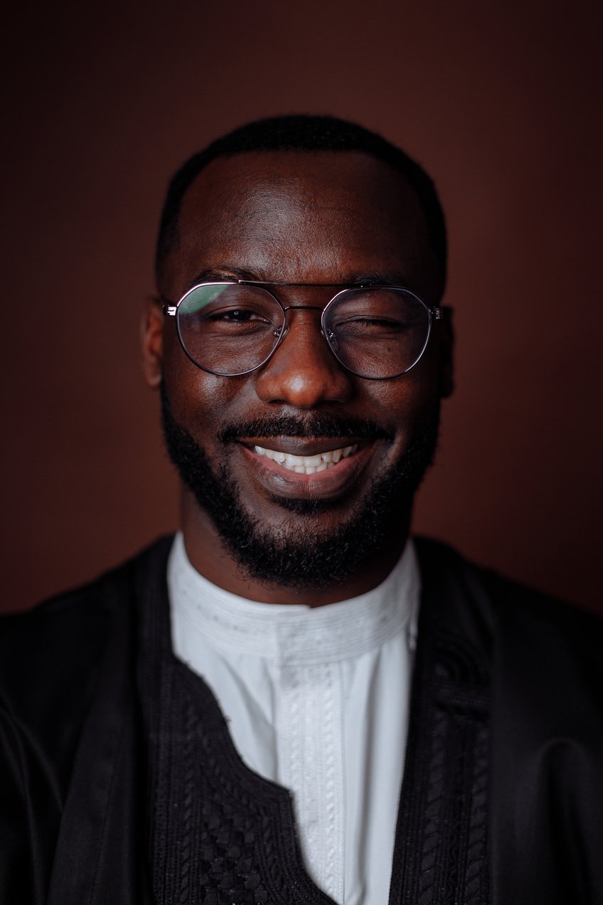 Man in Black Jacket Wearing Black Framed Eyeglasses